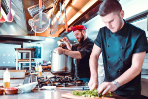 2 men cooking in the kitchen