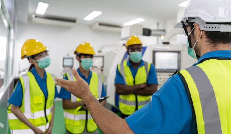 A man conducting a safety training to 3 individuals